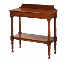 A Victorian mahogany dumb waiter, with rear upstand and two tiers raised on turned supports.