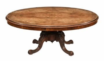 A Victorian oval loo table, reduced in height as a coffee table.