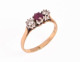 An 18 ct gold ruby and diamond three stone ring, Size P, gross weight 3 grams.