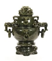 A 20th century Chinese hardstone or jade lidded pot, with carved dragons heads and integral rings,