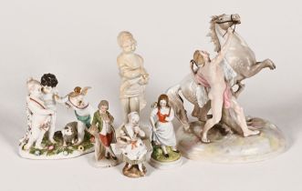 An early 19th century Staffordshire figure, draped cherub together with a continental figure group,