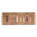 A rug with brown ground, decorated with panels of Islamic doorways or windows.