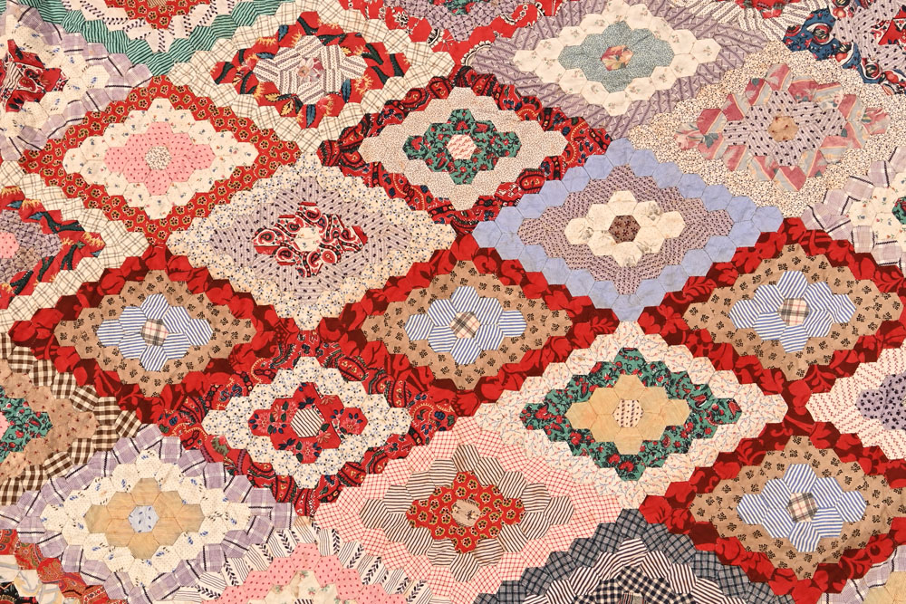 An antique hand stitched hexagonal honeycomb pattern patchwork quilt. - Image 3 of 3