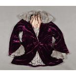 An early 20th century velvet jacket, purple with fur collar and cuffs.