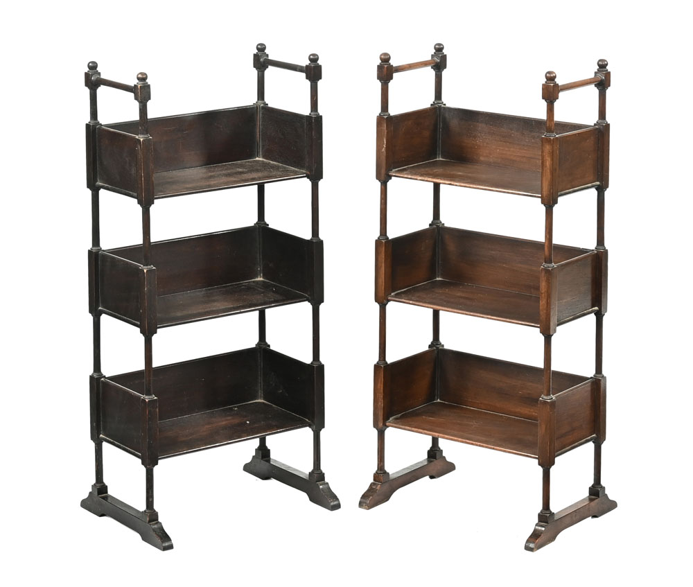 A pair of mahogany small open shelf units, three tier with sledge type supports.