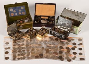A collection of vintage coins, contained within tins boxes and plastic folders.
