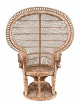 A large peacock chair, of typical form with outswept arms, circular seat and basketwork base.