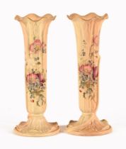 A pair of Royal Worcester slender vases,