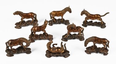 A set of eight Chinese horses, in the manner of Emperor Wang Mu,