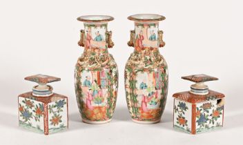 A pair of Canton vases, 25 cm high and a matching pair of oriental tea caddies.