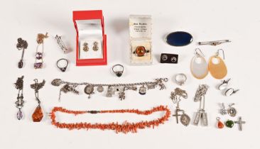 A bag of silver and other costume jewellery, including a charm bracelet.