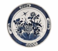 An antique oriental blue and white charger, depicting birds amongst foliage. 36 cm diameter.