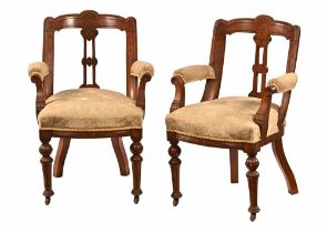 A pair of Victorian Scottish oak open armchairs,