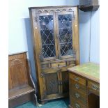Oak corner cupboard with glazed front