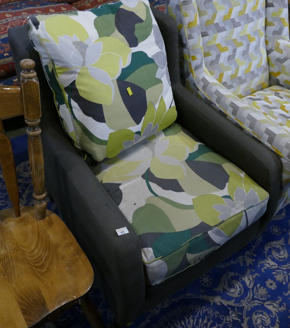 Grey and floral upholstered armchair