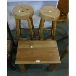 Two pine stools and small occasional table