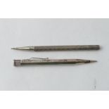 Two silver propelling pencils