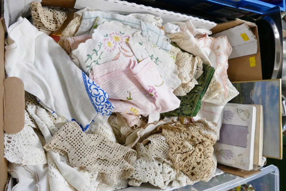 Box of crocheted dollies and hand embroidered linen pieces