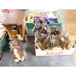 Three ceramic horse heads and wooden horse and caravan