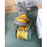 Jet washer with hose on reel