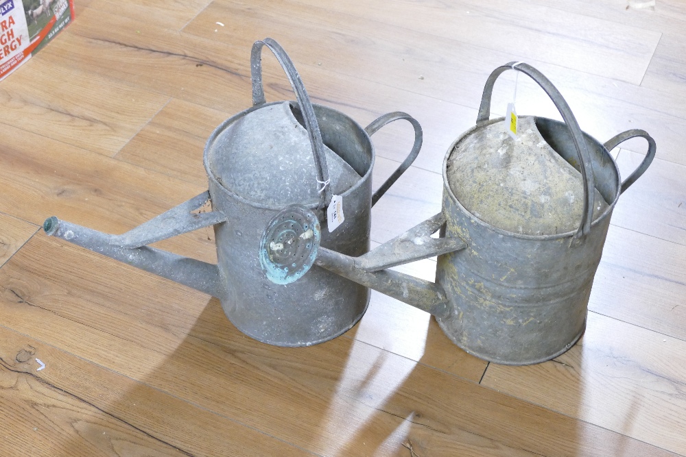 Pair of galvanized watering cans