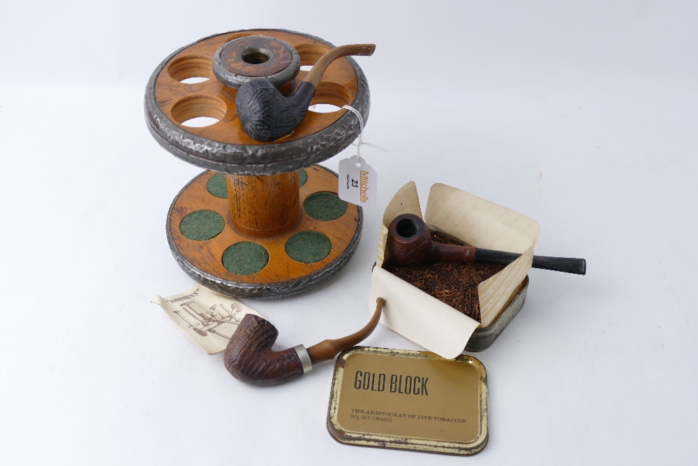 Three vintage pipes in wooden pipe stand and tin of Gold Block tobacco