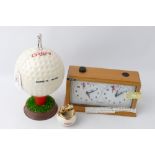 Novelty golf ball cigarette holder,