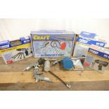 Assortment of air compressor accessories.