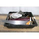 Box of tools which includes handsaw, mitre saw etc.