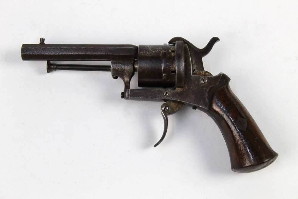 A Belgian Pinfire revolver, with a 3 1/4" hexagonal barrel, folding trigger and wooden grips.