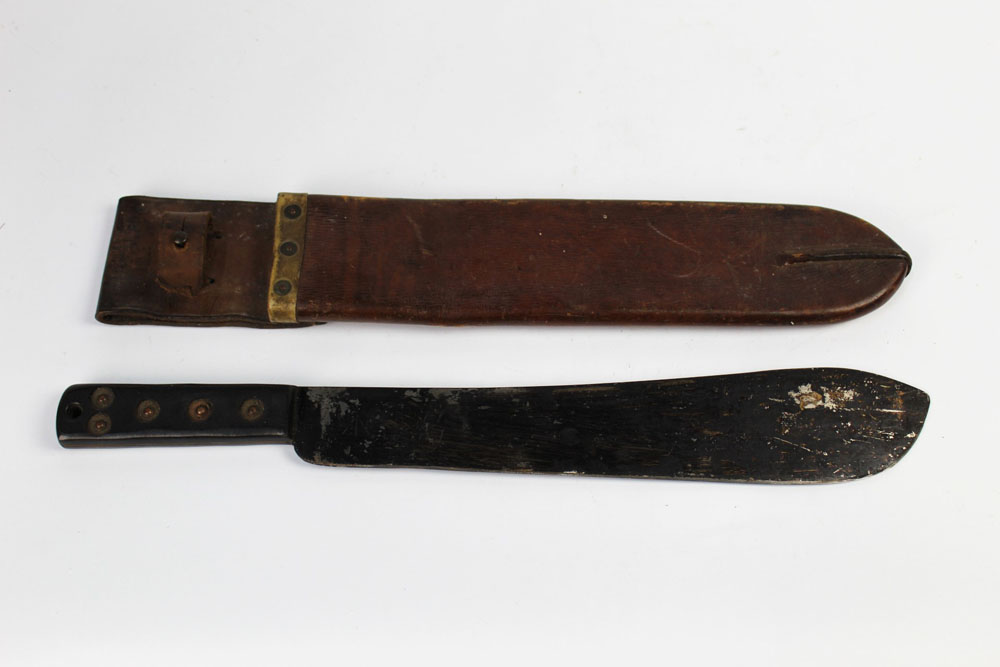 A military issue machete, the blade stamped with a broad arrow and Serial No.