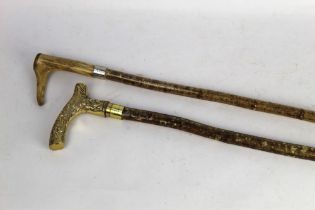 Two hazel shafted walking sticks, first with antler handle,