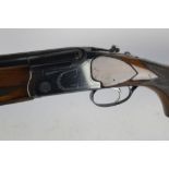 A Super Lanber 12 bore over/under shotgun, with 28" multichoke barrels, 70 mm chambers, ejector,