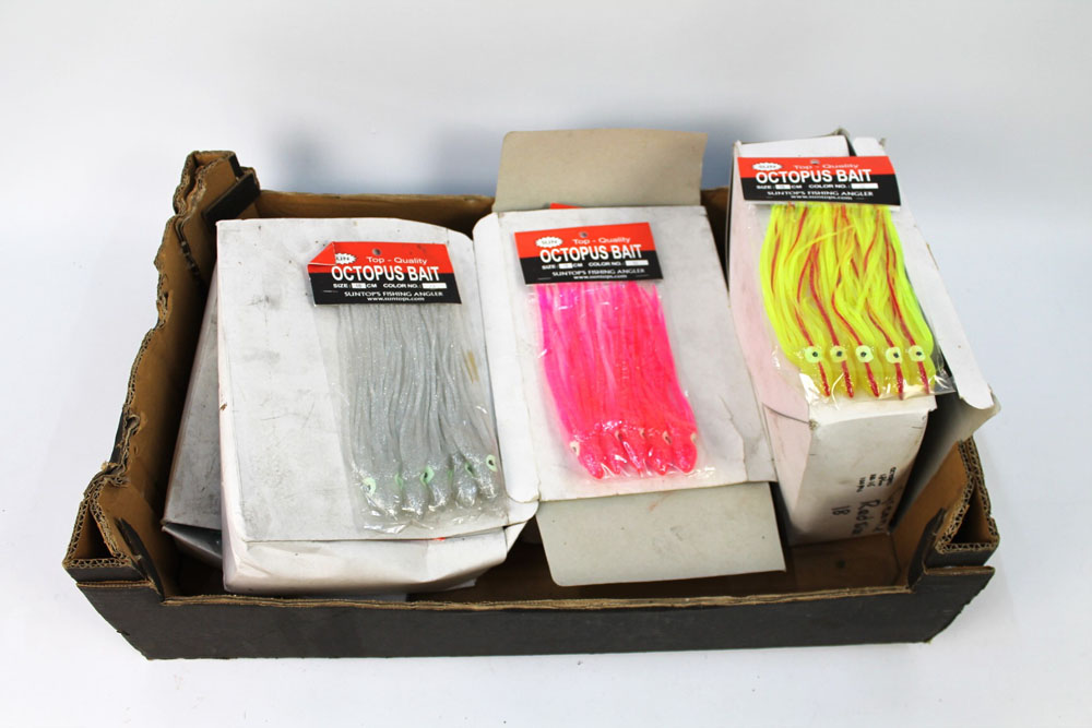 Four boxes of Octopus bait sea fishing lures.