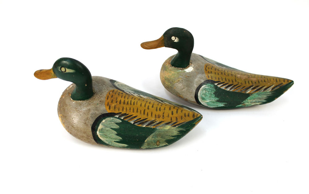 A pair of 20th century decoy ducks, beak to tail 37 cm.