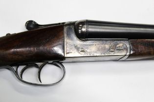 An AYA 12 bore side by side shotgun, with 28" chopper lump barrels, quarter and three quarter choke,