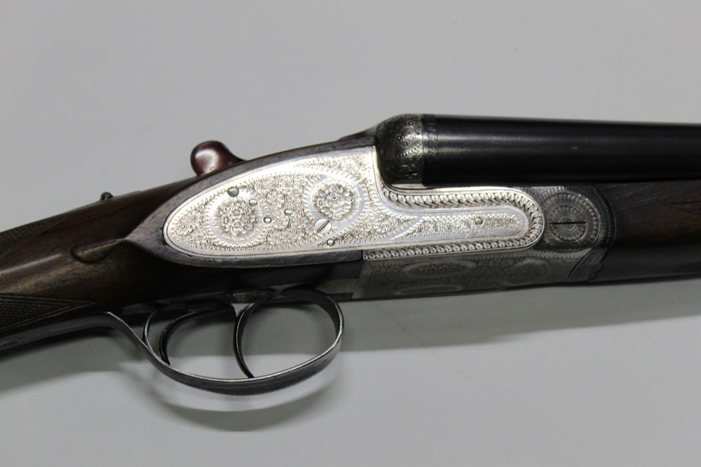 A Gunmark Black Sable Deluxe 12 bore side by side shotgun, with 27" barrels,