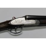 A Gunmark Black Sable Deluxe 12 bore side by side shotgun, with 27" barrels,