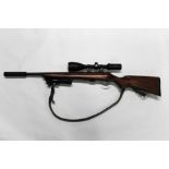 A CZ452 cal 22 LR bolt action rifle, fitted with an A-Tech Wave sound moderator,