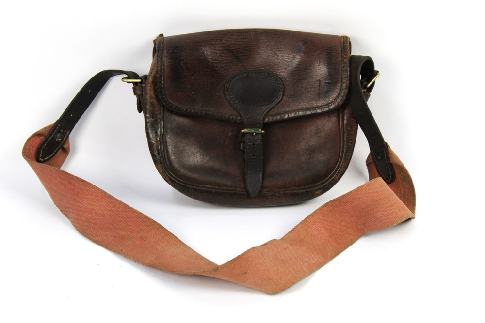A Brady cartridge bag, stamped to the rear Payne Galwey 75 made in England warranted cowhide.