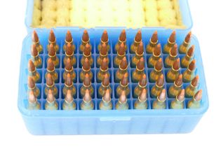 Fifty cal 243 ballistic tip rifle cartridges, in a blue plastic ammunition box.