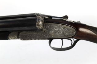 A Spanish 12 bore side by side shotgun, with 27 1/2" barrels, quarter and half choke,