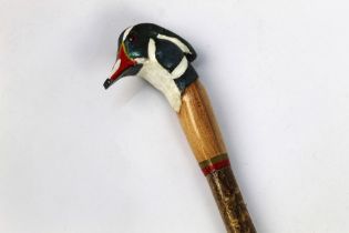 A walking stick with carved wooden handle in the form of a American wood duck, length 132 cm.
