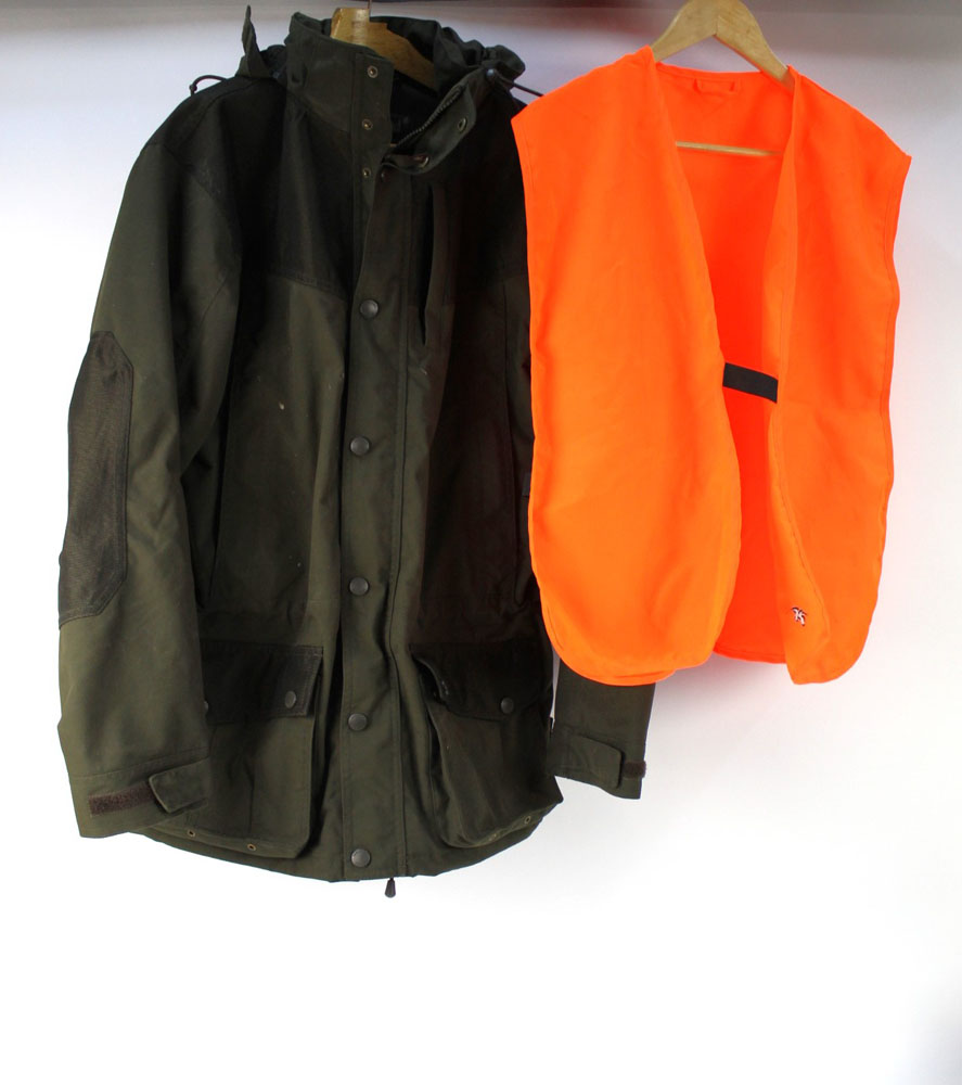 A Seeland shooting jacket Size EU50, together with a Seeland orange vest.