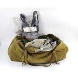 A vintage canvas duffle bag, containing a pigeon hide net, various crow and pigeon decoys.