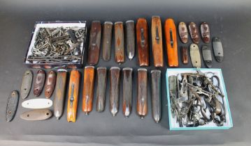 A selection of shotgun parts, or gunsmithing spares to include fore ends, various hammers,