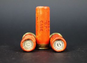 Three Eley GP paper case cartridges 12 bore, the end caps marked A Ward Thompson Middlesborough.