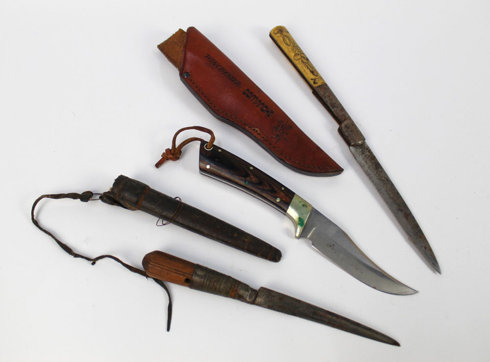 Three hunting knives, a Winchester Comanche fixed blade with a 4 1/2" blade with sheath,