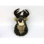 A children's soft toy wall hanging stags head, protruding from the wall +/- 34 cm.