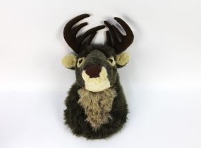 A children's soft toy wall hanging stags head, protruding from the wall +/- 34 cm.